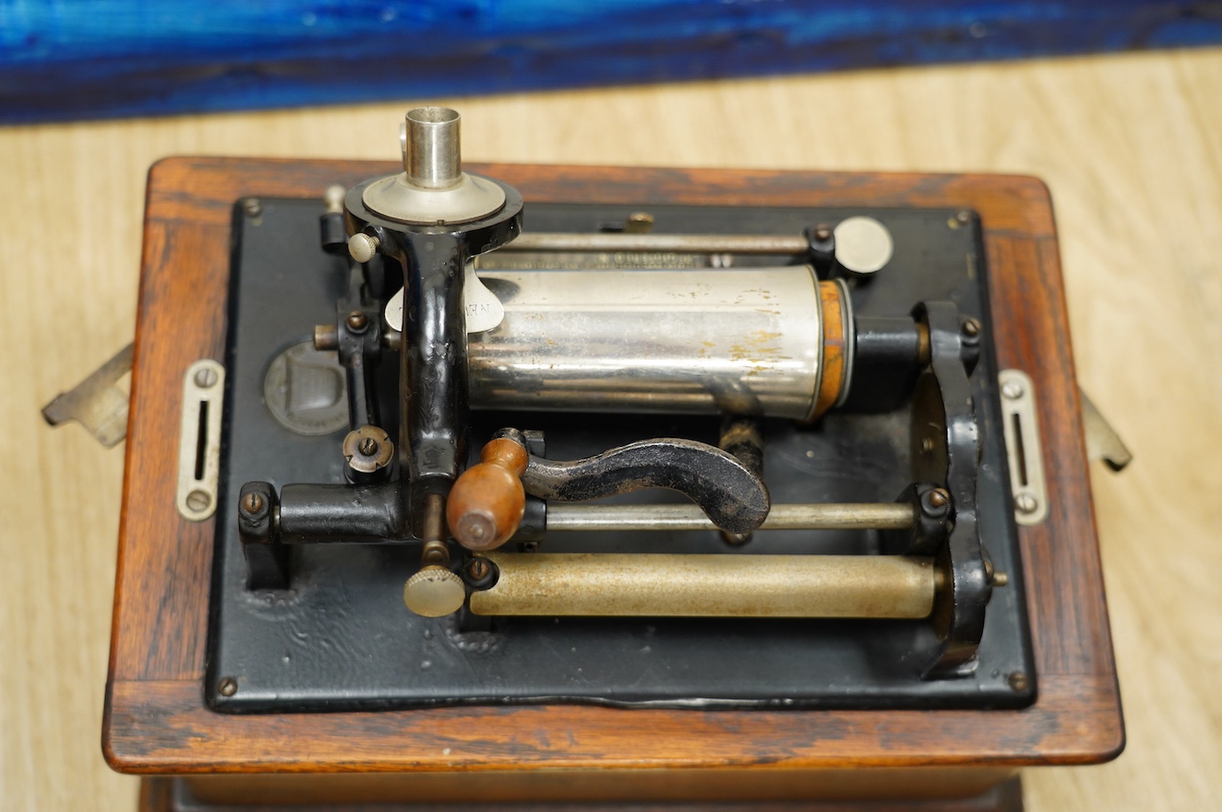 An oak cased Edison phonograph with ten rolls and a small table top polyphon with twelve 8 inch discs (2). Condition - fair to good.